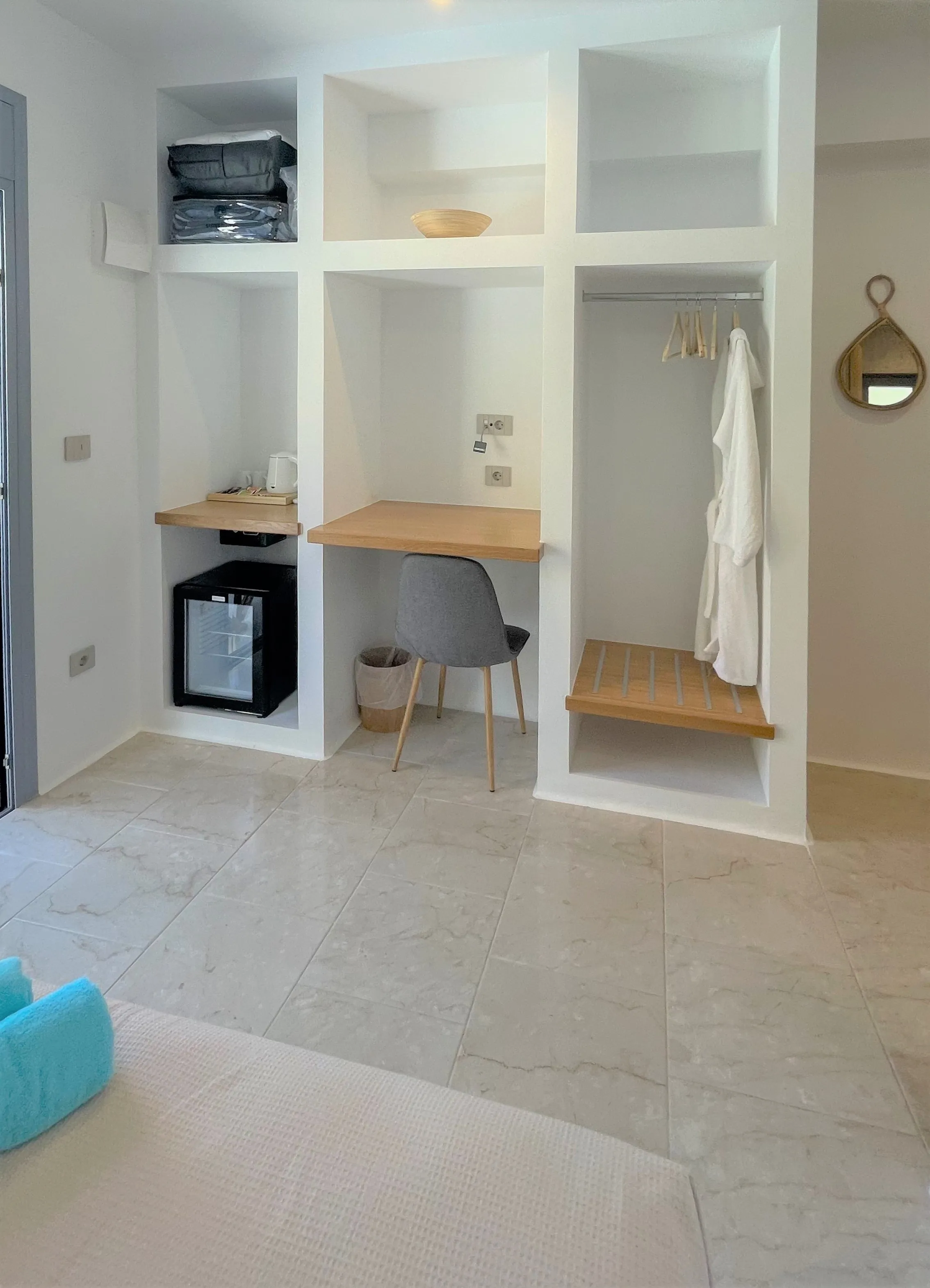 Scirron interior with wardrobe, desk and soft turquoise accents